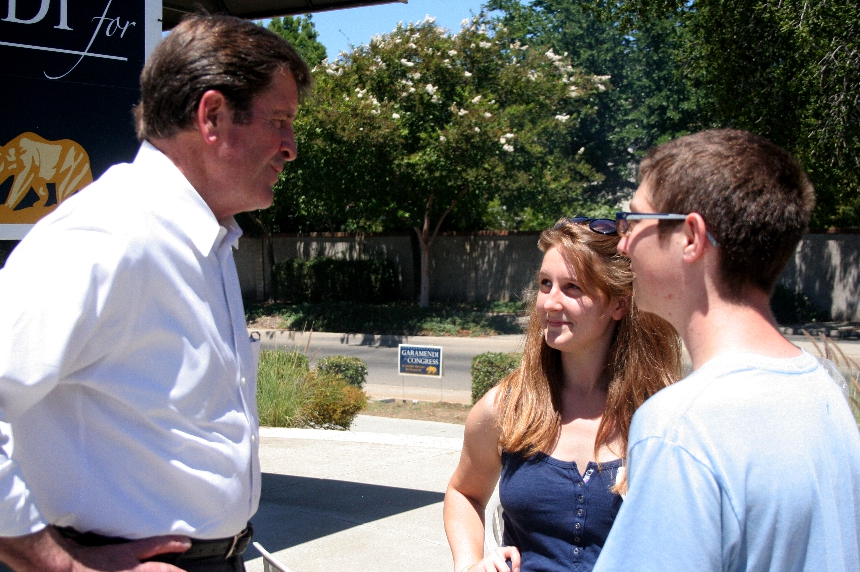 Congressman John Garamendi chats with two high school interns.